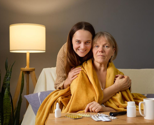 care at home after hospital family carer supporting elderly woman recovering at home in Blackpool