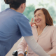 Dementia training for carers in action as a specialist supports an elderly person at home