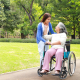 Carer and elderly woman sharing a warm conversation at home to support emotional well being